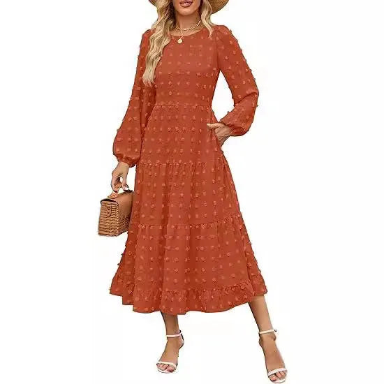Beige women's high-waisted long sleeve dress with ruffled sleeves on a hanger.