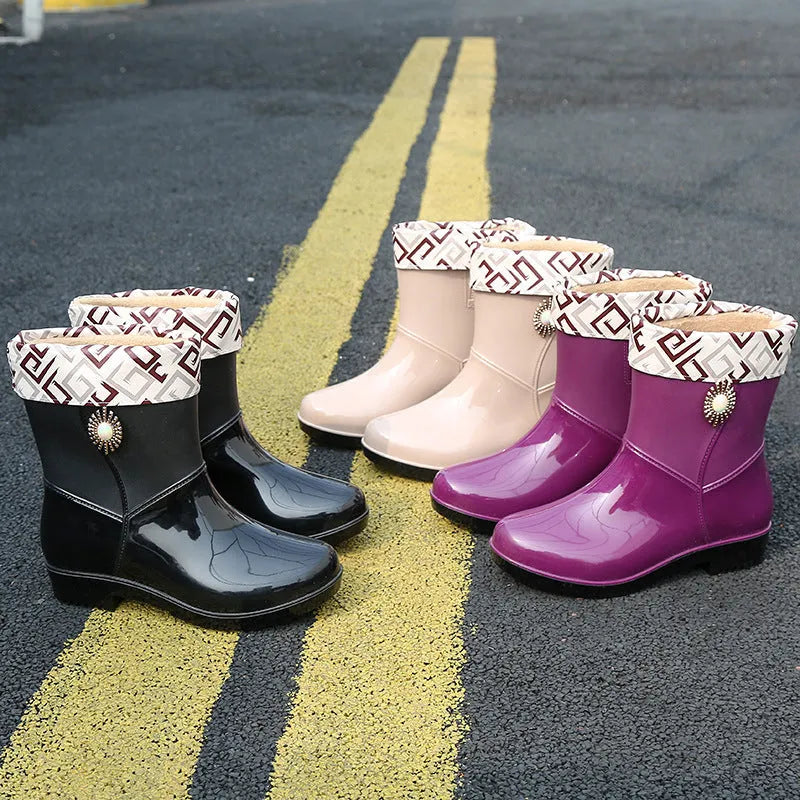 Women's mid-calf PVC rain boots in purple, black, or beige with a non-slip sole.