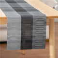 Modern simple PVC place mat in gradient bamboo pattern on a wooden table.