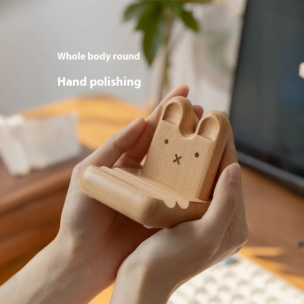 Creative Bunny Tatami Wooden Mobile Phone Stand with bunny design on a wooden desk