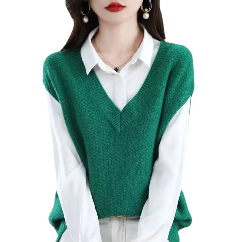 Women's creamy-white V-neck sleeveless knit vest with a raised 3D pattern texture.