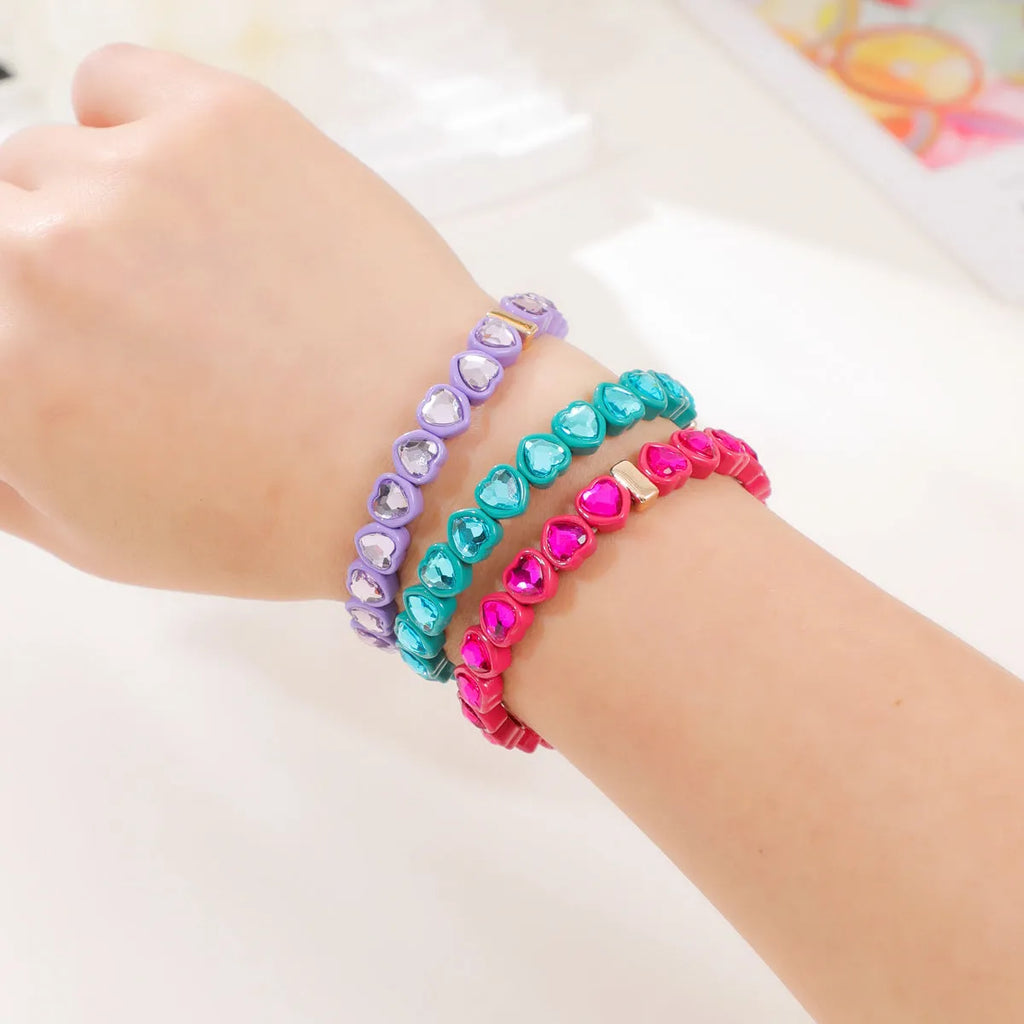 Rainbow enamel heart bracelet in alloy with colourful stretch band and unisex styling