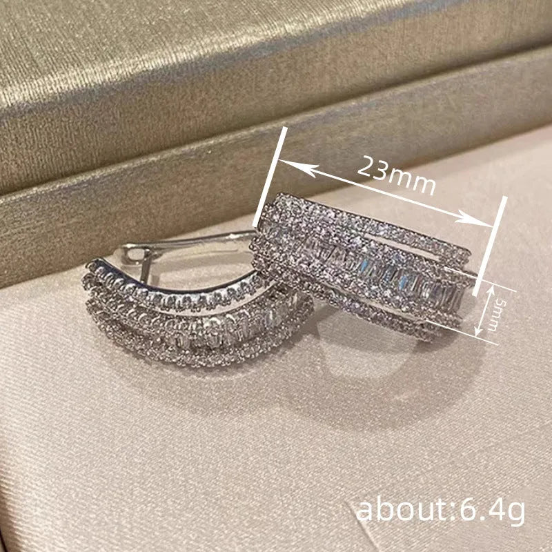 Geometric stud earrings with white gold colour finish and inlaid zircon stones