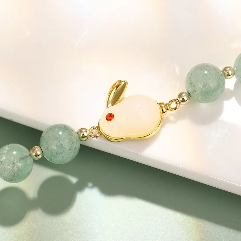 Rabbit bracelet with green aventurine and strawberry quartz beads, copper plating and gold accents