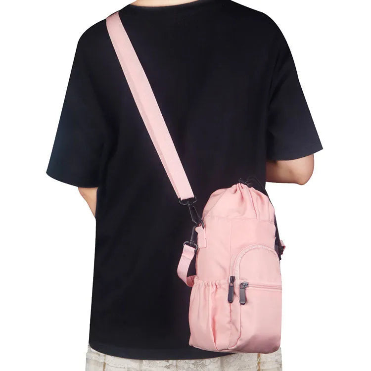 Canvas water bottle pouch with crossbody strap in black, green, or pink colour