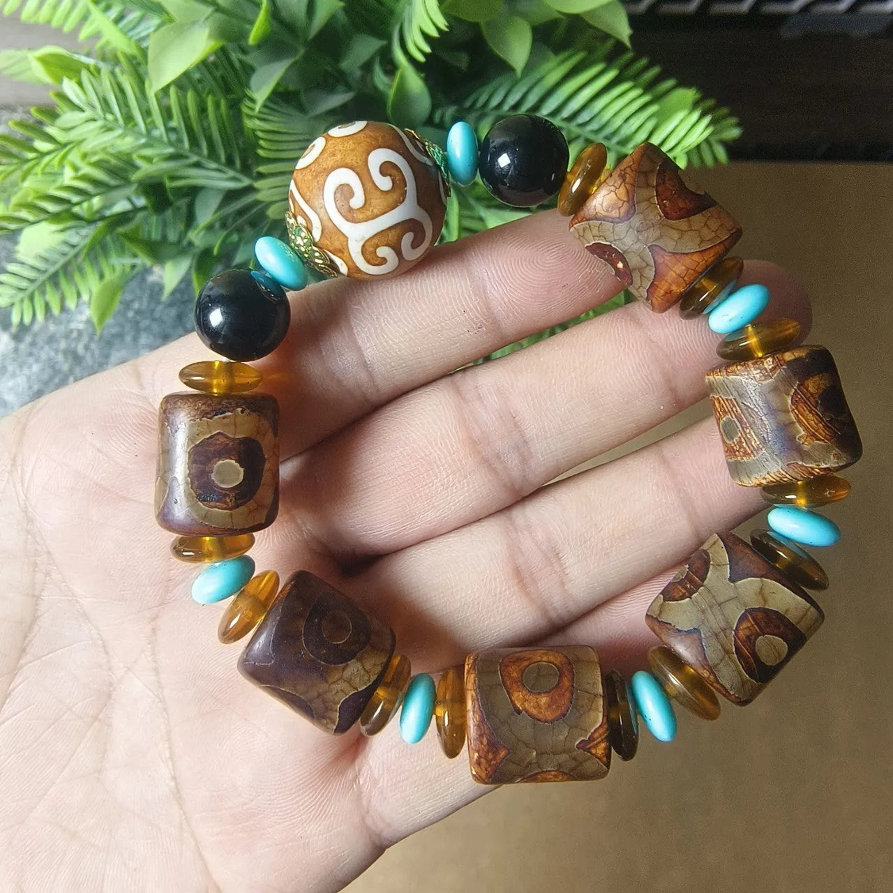 Distressed agate Tibet beads bracelet with three eye dzi design and polished stone beads
