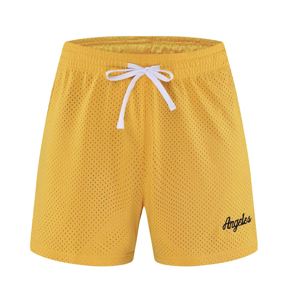 Men's double-layer mesh sports shorts in black polyester fabric showing side profile with elastic waistband