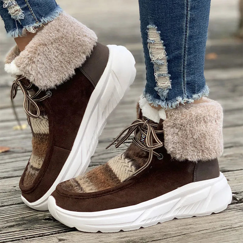Women's beige lace-up snow boots with fuzzy lining and a thick platform sole on a white background.