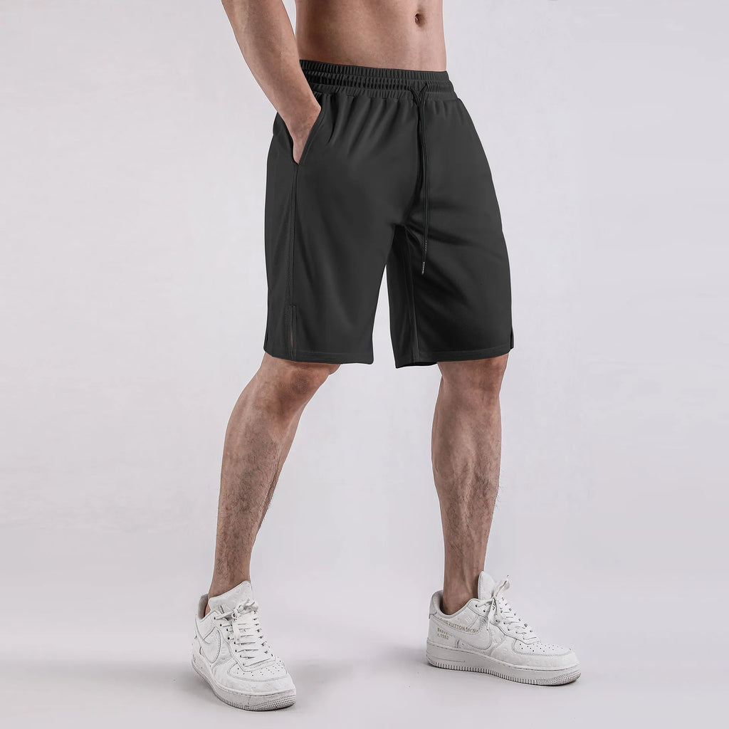 Men's black quick-drying mesh shorts with elastic waistband, shown in a loose casual fit.