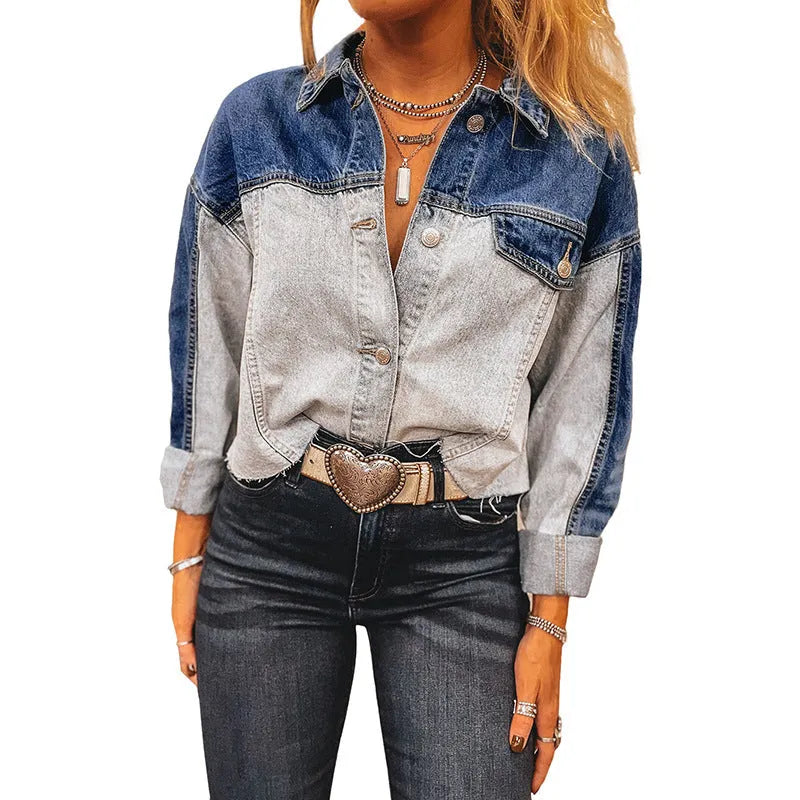Blue women's loose fit denim coat with a single row of multiple buckles down the front.
