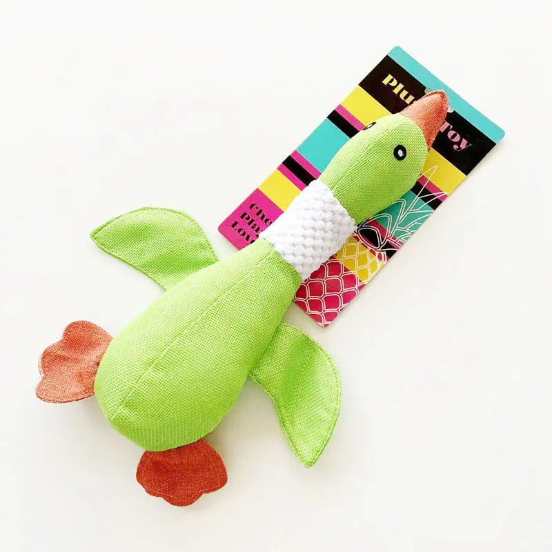Blue, green or grey duck-shaped plush dog toy with two squeakers.