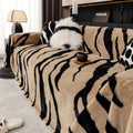 Zebra pattern flannel sofa cover with matching pillowcase in caramel colour on grey sofa