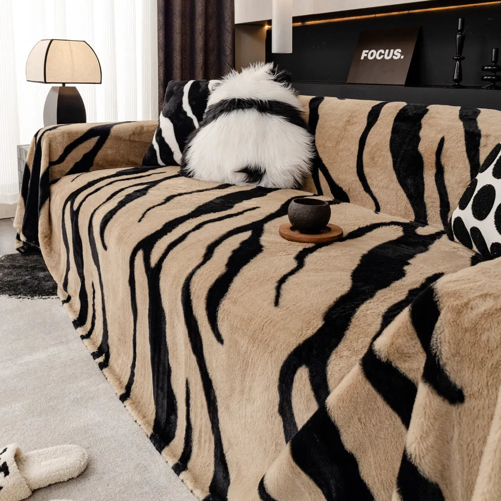 Zebra pattern flannel sofa cover with matching pillowcase in caramel colour on grey sofa
