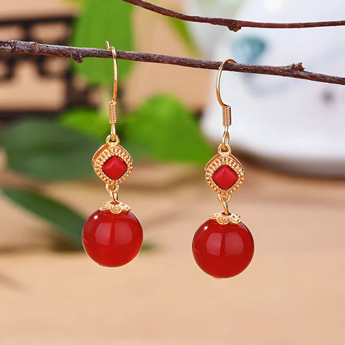 Geometric copper alloy earrings with round Southern red agate beads set in S925 silver.
