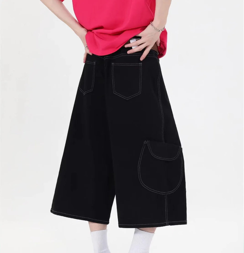 Retro multi-pocket denim workwear shorts in wide leg cropped design shown in red and black colours