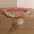 Women's natural bracelet with strawberry quartz, white agate beads, and auspicious cloud charms