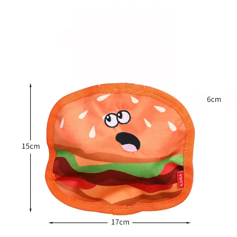 Four colourful dog toys shaped like hamburger, fries, hot dog and pizza with crinkle and squeak features