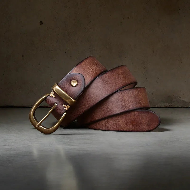 Men's brown cowhide leather casual belt with copper pin buckle on a flat surface