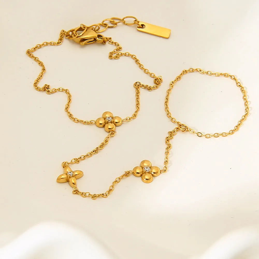 Women's gold stainless steel bracelet with eight-pointed stars and floral geometric design