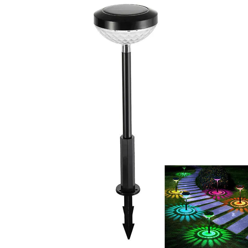 Solar garden light water droplet projection on lawn with colourful LED glow