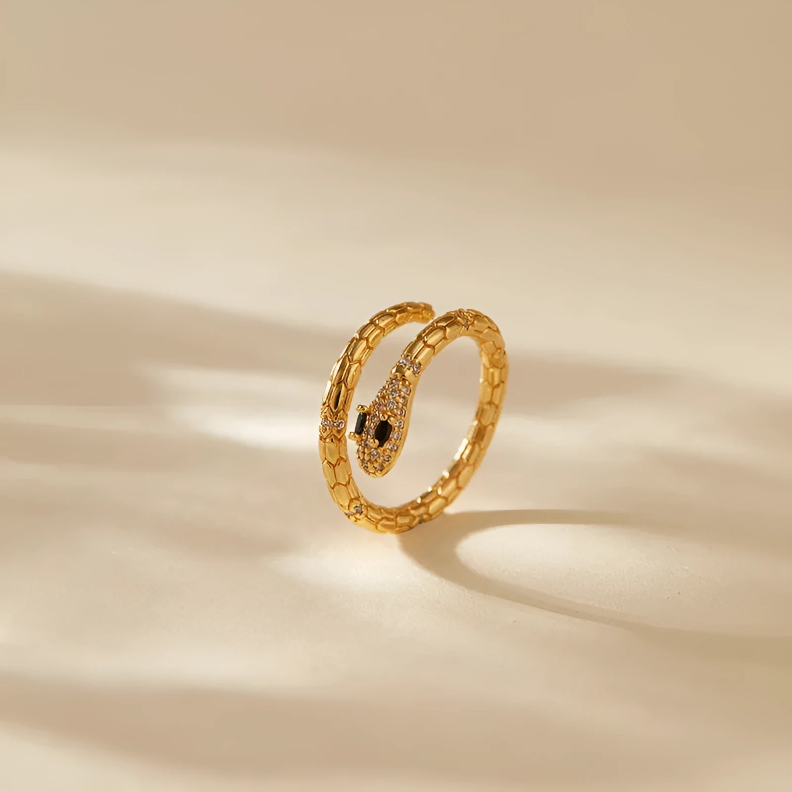 Adjustable snake finger ring for women in gold colour with diamond treatment on copper