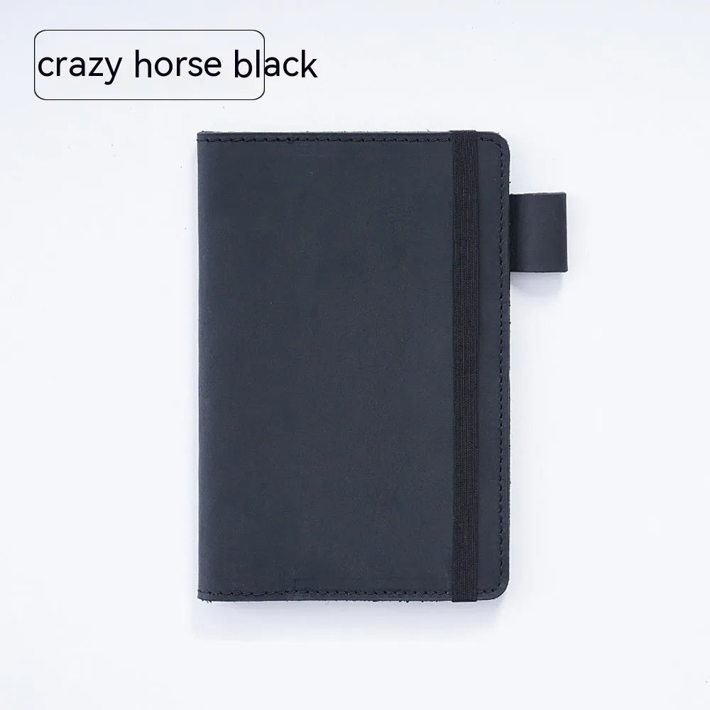 Handmade kraft notebook with cowhide cover in choice of six colours, showing open pages of wood-free paper.