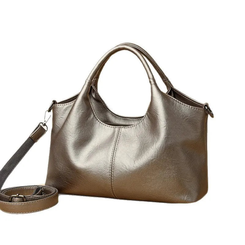 Genuine leather women's cross-body bag in beige colour showing large capacity design