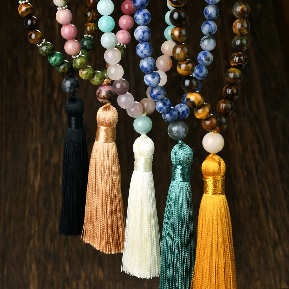 Long beaded bohemian necklace with 108 natural stones, a geometric pendant, and colourful tassels on an 81cm chain.