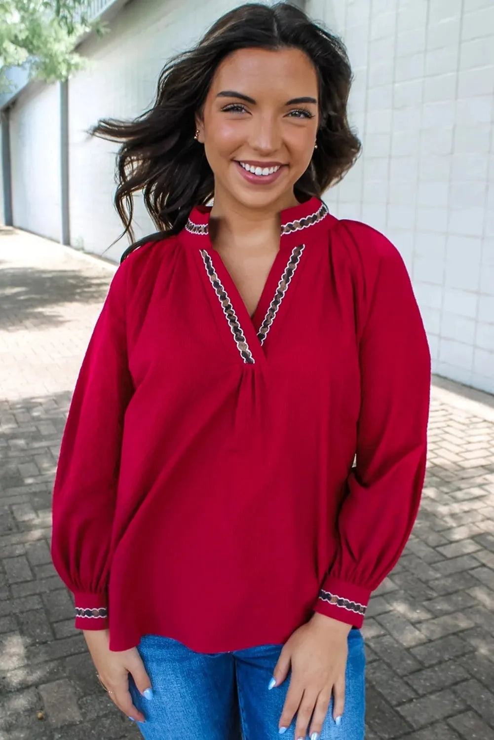 Women's red polyester pullover shirt with embroidered collar and printed design, loose fit