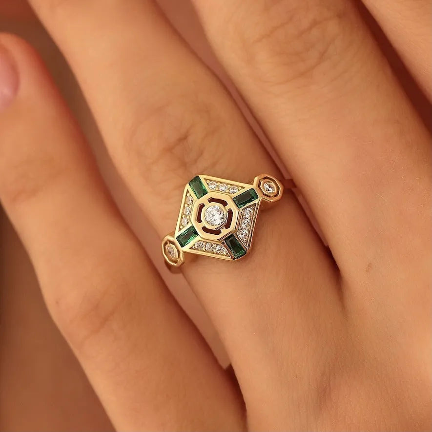 Emerald green geometric square-cut women's diamond ring with electroplated finish on a plain background.