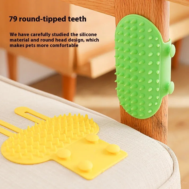 Silicone cat grooming massage comb with adjustable strap mounted on a table leg.
