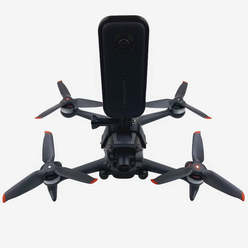 3D printed hard plastic expansion bracket with sponge padding for top-mounting GoPro cameras on FPV drones.