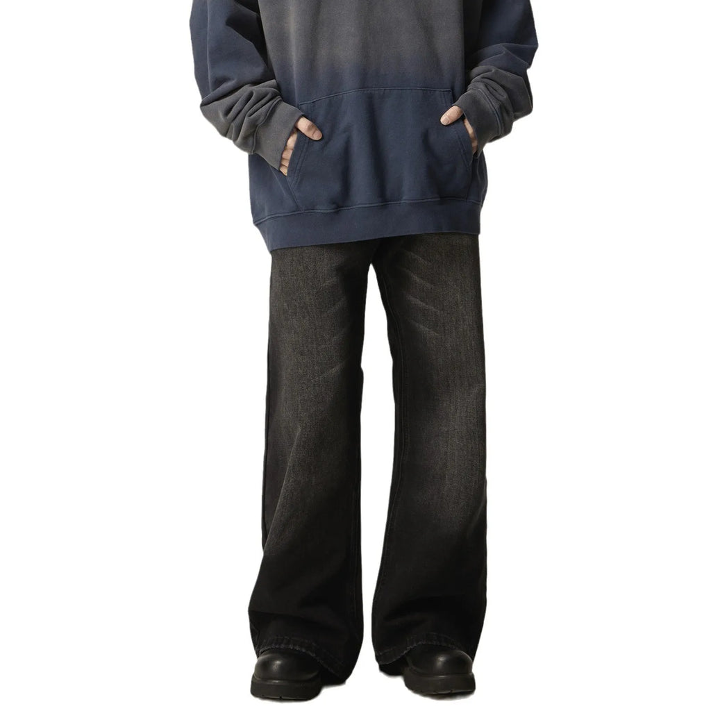 Black loose-fit straight-leg retro jeans with a zipper fly on a mannequin