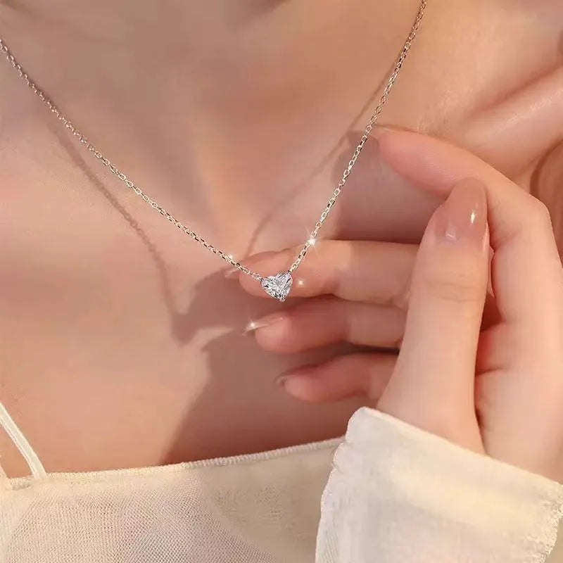 Women's silver heart-shaped love necklace on copper chain with simple refined design