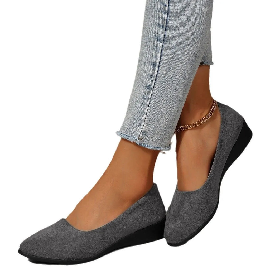 Women's pointed toe suede wedge pumps with a low heel and shallow V-cut opening in multiple colours.