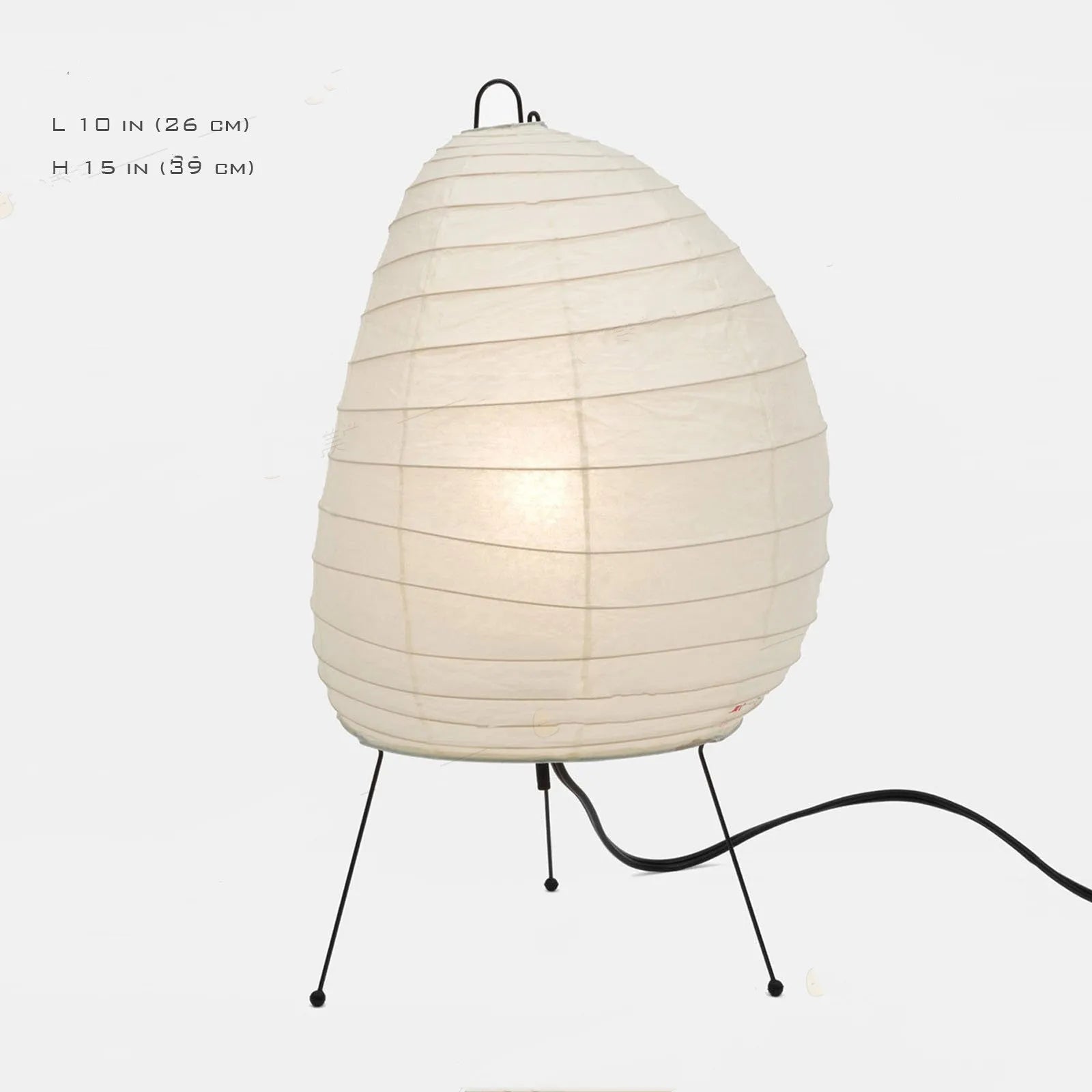 Japanese style table lamp with handmade paper shade and aluminium base on a wooden surface.