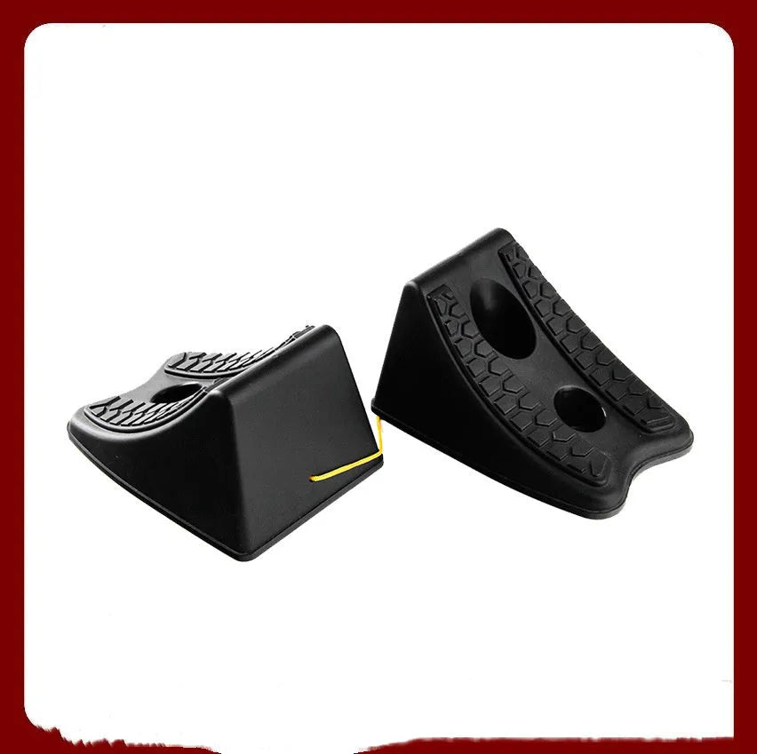 Pair of black wedge-shaped rubber car wheel stoppers with arc bevel and anti-slip base