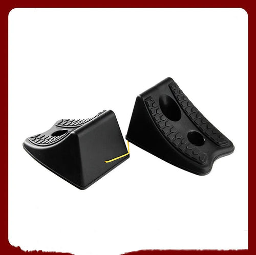 Pair of black wedge-shaped rubber car wheel stoppers with arc bevel and anti-slip base