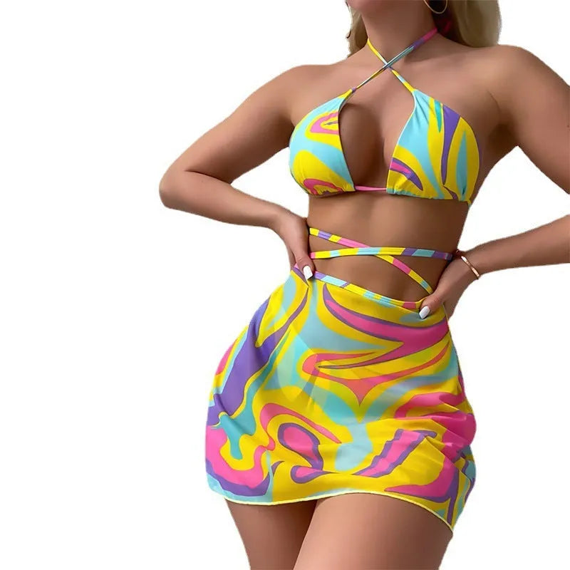 Yellow striped halter neck swimsuit set for women, showing top, skirt, and shorts with lace-up detail.