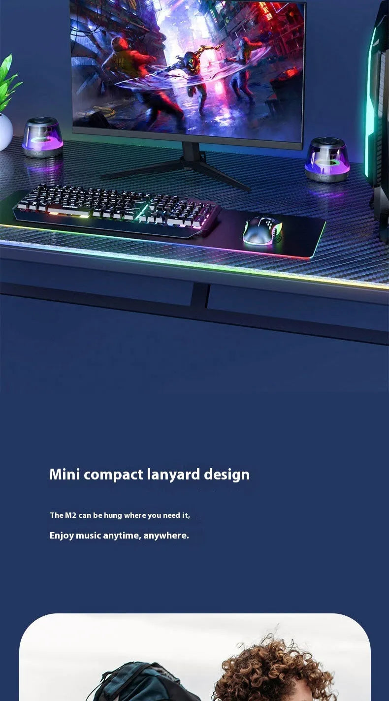 Portable white or black Bluetooth speaker with ambient lighting and magnetic design on a desktop