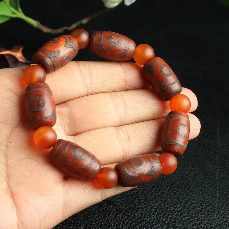 Distressed agate Tibet beads bracelet with three eye dzi design and polished stone beads