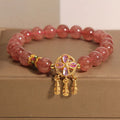 Women's adjustable strawberry quartz bracelet with four leaf dream catcher ball pendant and crystal beads