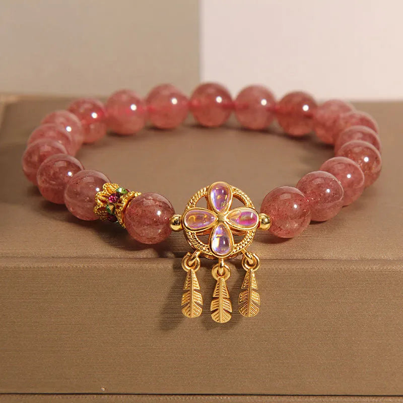 Women's adjustable strawberry quartz bracelet with four leaf dream catcher ball pendant and crystal beads
