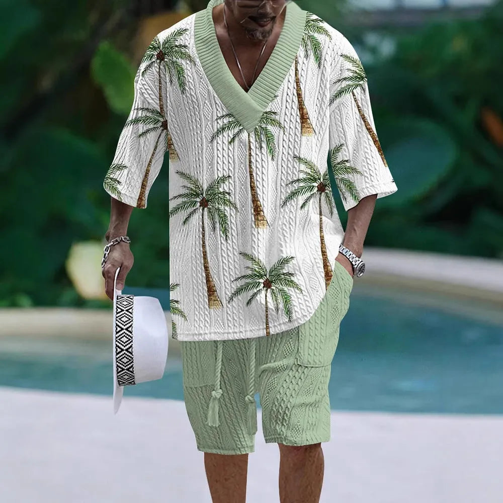 Man wearing a loose-fitting casual short sleeve suit with matching shorts in a solid colour.
