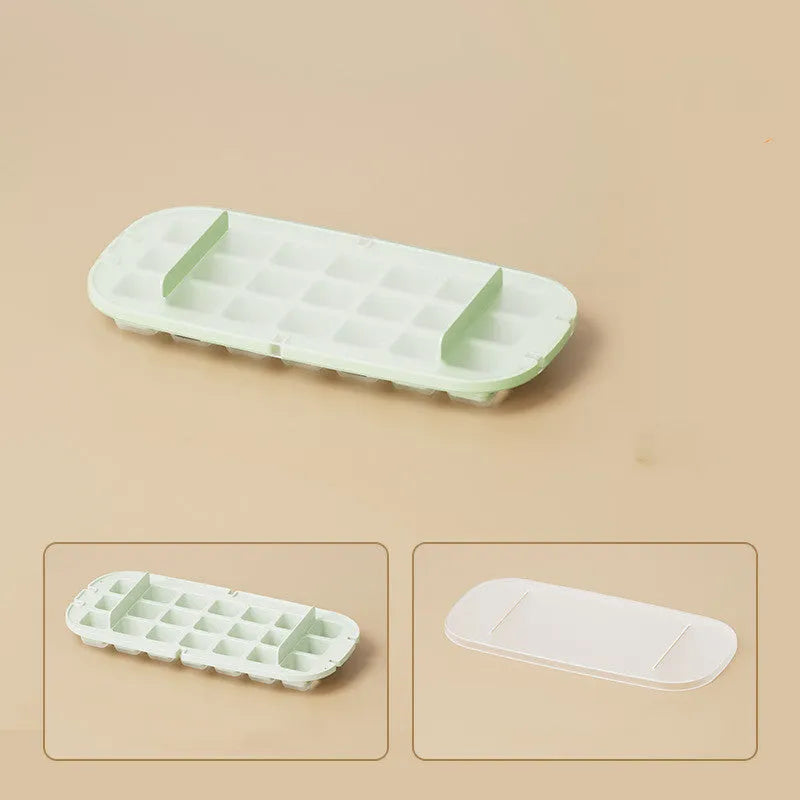 High capacity blue ice cube tray with ice grid and attached storage for the included shovel.