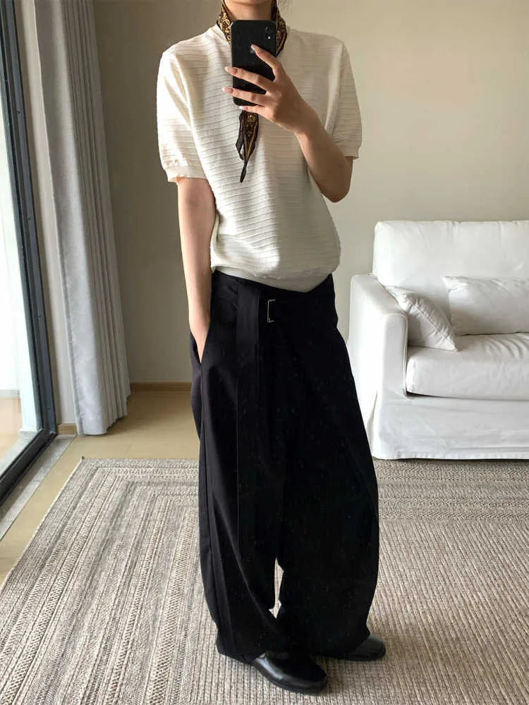 Black straight-leg trousers with adjustable waistband and single pleat design in Tencel cotton fabric