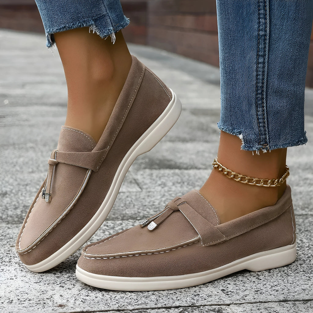 Women's casual tassel one pedal loafers in brown with round toe and low flat heel on a white background