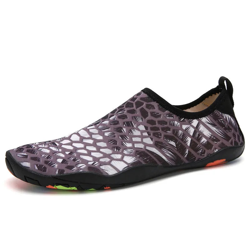 Men's and women's beach wading shoes in blue, with Lycra upper and EVA midsole, on a sandy background.