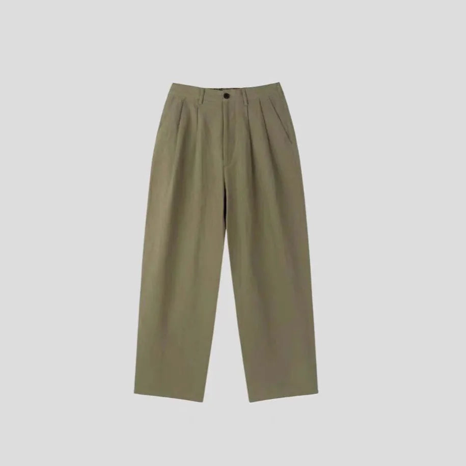 Men's apricot loose-fit cotton linen trousers with a pencil pants leg opening and micro-elastic waistband.