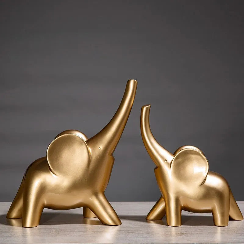 Modern resin and plastic elephant ornament in rose gold or white colour, available in large, small, or pair sizes.